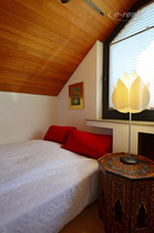 Modern furnished guest room with sloping ceilings in Hilden